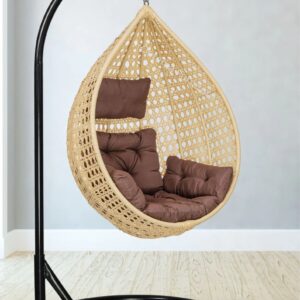 Cream and brown wicker swing for outdoor leisure."