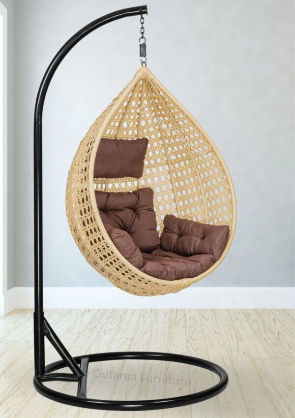 Cream and brown wicker swing for outdoor leisure."